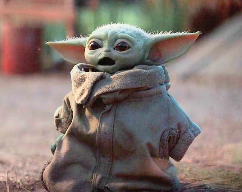 The meme is an image of the character Yoda from the Star Wars franchise, but it's not Yoda - it's actually a character called "Baby Yoda" or "The Child" from the Disney+ series "The Mandalorian". The image is a screenshot of the character looking surprised or shocked, with its large eyes and expressive face.